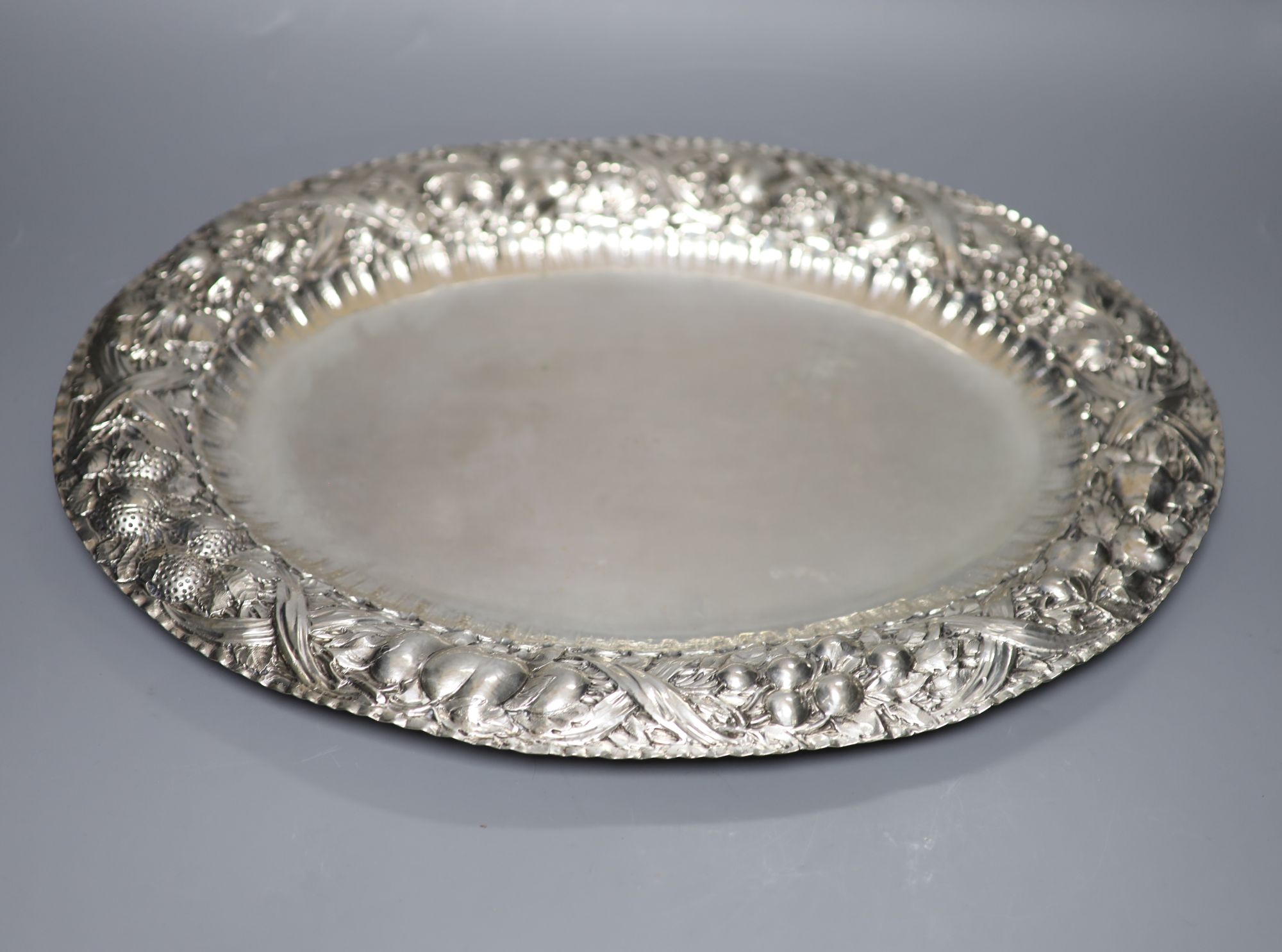 An Italian 800 standard white metal oval tray, the edge embossed with fruits 35oz approx; L 48.5cm